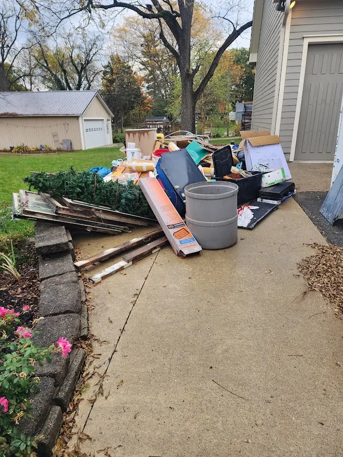 Dumpster being loaded with debris for 3 Yard Dumpster Rental in Oostburg